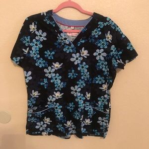 Black and light blue floral print scrub top